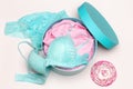 Open round gift box with blue lingerie set and pink flower