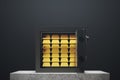 Open safe box, black wall, gold ingots Royalty Free Stock Photo