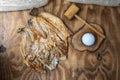 Open salty dried fish on a rustic wood with salt grains Royalty Free Stock Photo