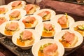 Open sandwich with ham and vegetables served in a small plate at a wedding party Royalty Free Stock Photo