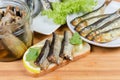 Open sandwich with preserved smoked sprats close-up Royalty Free Stock Photo