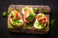 Open sandwich set with cream cheese, prosciutto, salmon, avocado and fresh greens. Royalty Free Stock Photo