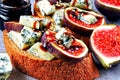 Open sandwiches with figs and blue cheese. Royalty Free Stock Photo