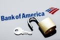 An open security lock and key on background of Bank of America logo in mirror reflection Royalty Free Stock Photo