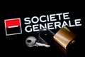 An open security lock and key on background of Societe Generale bank logo in mirror reflection Royalty Free Stock Photo