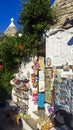 Open shop with different souvenirs and postcards in Alberobello city