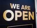 A `we are open` shop sign. Open for business.