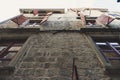 Open shutters of windows on an old stone wall. Bottom view. Building with clothesline outside the home wood window Royalty Free Stock Photo