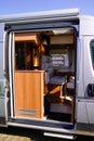Open side door vehicle interior view of motorhome modern camper rv van Royalty Free Stock Photo