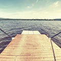 Open side ramp on small car and passenger ferry boat on lake Royalty Free Stock Photo