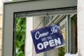 Open sign board blue hang on street shop restaurant cafe store door Royalty Free Stock Photo