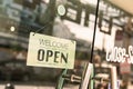 Open sign broad through the glass of window at coffee shop. Royalty Free Stock Photo