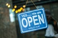 Open  sign broad through the glass of window at coffee shop Royalty Free Stock Photo