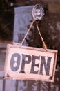 Open sign broad through the glass of window Royalty Free Stock Photo