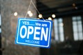 open sign broad through the glass of window at coffee shop Royalty Free Stock Photo