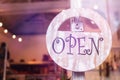 Open sign broad through the glass of window at the shop. Royalty Free Stock Photo