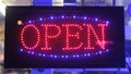 Open sign in front of shop