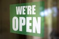 Open sign on the glass of the door at store Royalty Free Stock Photo