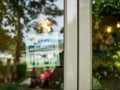 An open sign hangs behind the glass of a shop door. The idea of starting a business. busisness concept