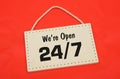 We are open sign on red cloth background