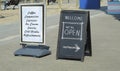 Open sign, restaurant or cafe ready to service after corona lockdown, billboard with menu, food and drink, sandwich board in a