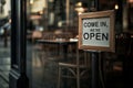 open sign Restaurant door handle with push sign on glass doors.