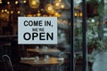 open sign Restaurant door handle with push sign on glass doors.