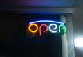 Open sign on storefront. Small business. Illuminated