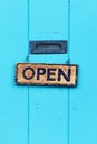 Open Sign on Turquoise Door