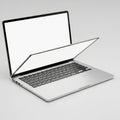 Open Silver Laptop Computer with Blank White Screen and Keyboard on a Light Gray Background Royalty Free Stock Photo