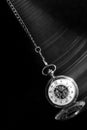 Pocket watch swinging on chain with motion blur trail Royalty Free Stock Photo