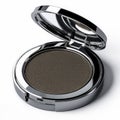 Open silver round compact with brown powder and interior reflecting mirror Royalty Free Stock Photo