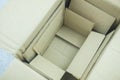 Open small cardboard boxes stacked inside Royalty Free Stock Photo