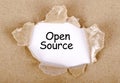 Open source word written on torn paper Royalty Free Stock Photo