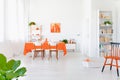 White and orange colored living room interior in modern home. Royalty Free Stock Photo
