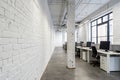 Open space office with concrete floor and desks Royalty Free Stock Photo