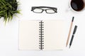 Open spiral blank notebook on white desk Royalty Free Stock Photo