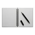 Open spiral notebook with black pen and cap on transparent background Royalty Free Stock Photo