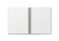 Open spiral notebook with blank white pages on a white background, top view Royalty Free Stock Photo