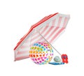 Open striped beach umbrella, inflatable ball and accessories on white background Royalty Free Stock Photo