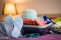 Open suitcase on bed Royalty Free Stock Photo