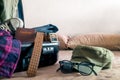 Open suitcase on bed packing Royalty Free Stock Photo