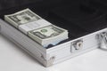 Open suitcase with one million dollars bills with tape Royalty Free Stock Photo