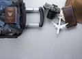 Open suitcase packed for travelling with Thailand passport on grey background - travel concept - Image Royalty Free Stock Photo