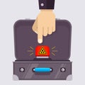 Open suitcase with a red nuclear button. hand with Royalty Free Stock Photo