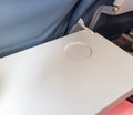 Open table for an airplane tray with a glass stand, close-up Royalty Free Stock Photo