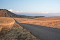 Open tar road headed into the horizon Royalty Free Stock Photo