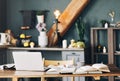 Open textbook with pen, laptop, stack of uncovered books and cup of coffee on table at home office Royalty Free Stock Photo