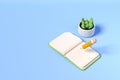 Open textbook with plant and pencil writing. Mockup copy space Royalty Free Stock Photo