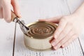 Open tinacan with knife, close up Royalty Free Stock Photo